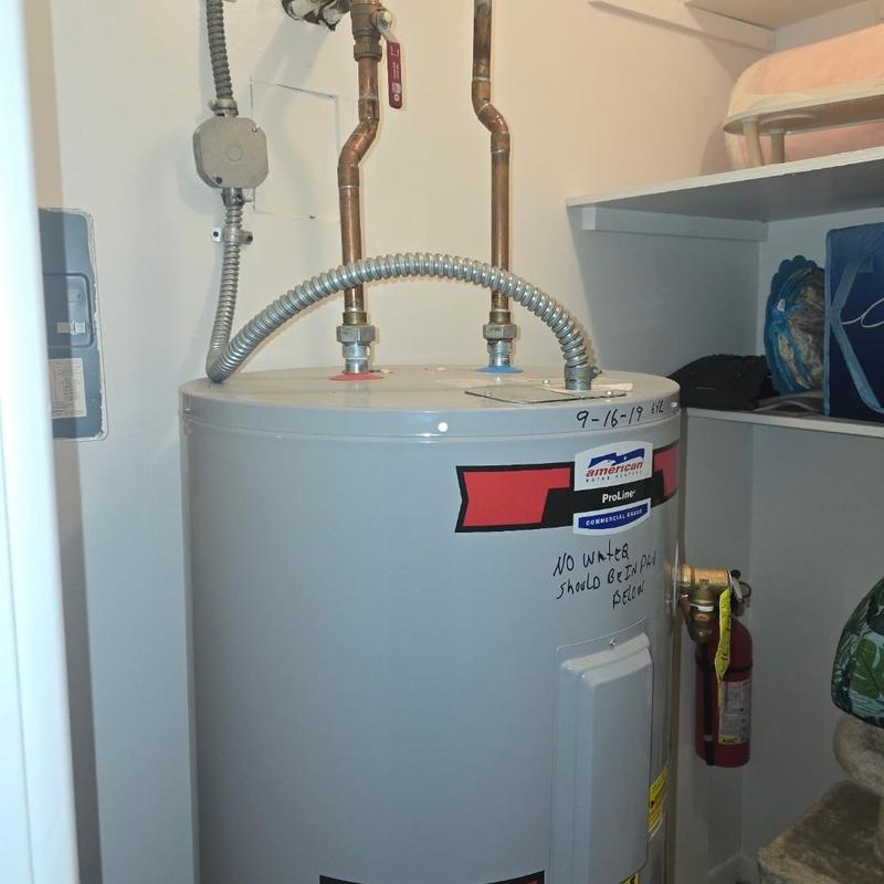 Water heater with copper piping in utility closet