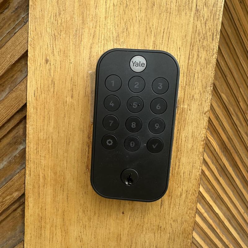 Yale keypad lock on wooden door panel Yale keypad lock on wooden door panel