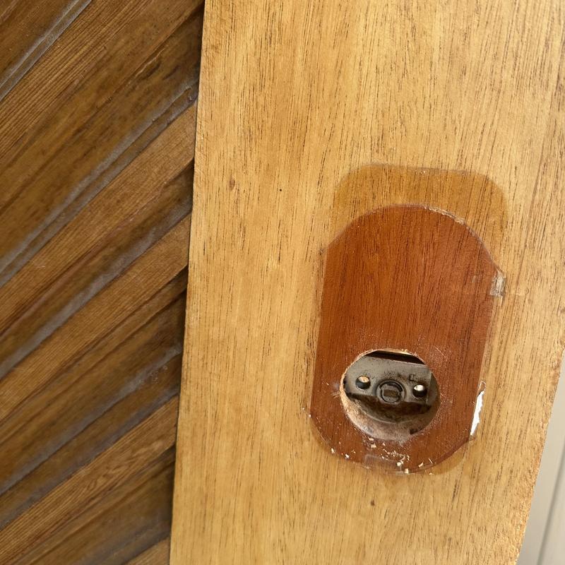Keypad lock removed from wooden door cavity Keypad lock removed from wooden door cavity