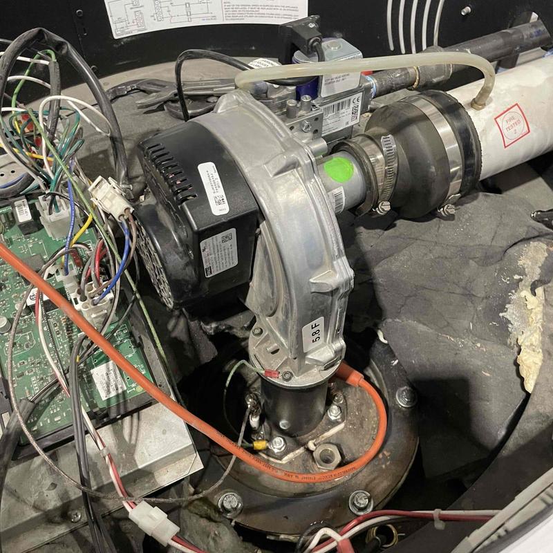 Water heater burner assembly and exhaust inspection