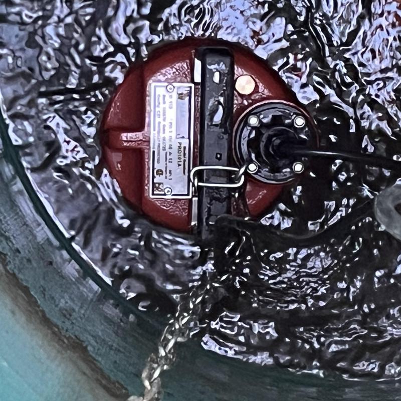 Sewage ejector pump operating inside lift station basin