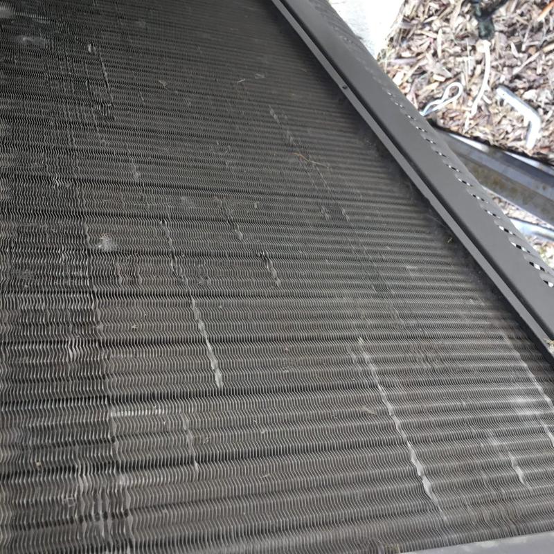 Condenser coil with accumulated dirt and debris