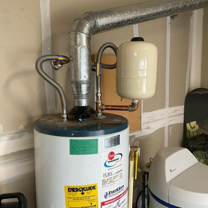 Water heater with expansion tank and vent piping