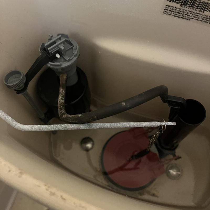 Toilet flush valve assembly with corroded fill tube inside tank
