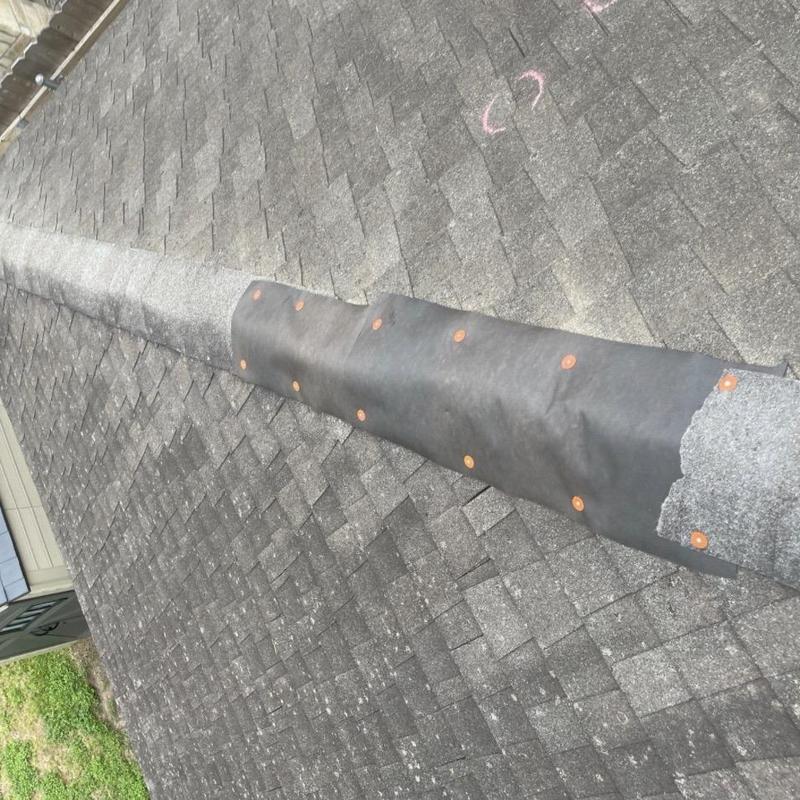 Roof ridge waterproof membrane installation on shingle roof