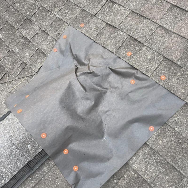 Roof underlayment temporary cover with fasteners