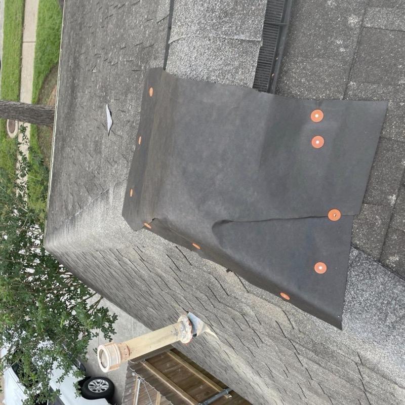 Emergency roof waterproof membrane installation on ridge