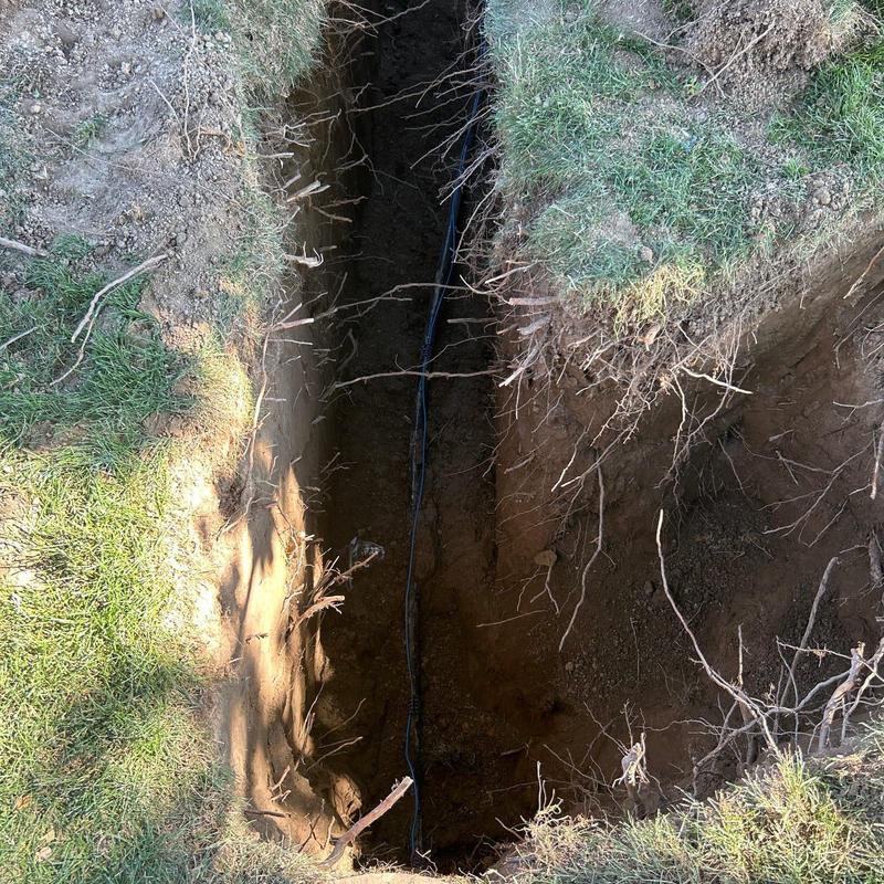 1-inch pipe trench excavation with cable installation