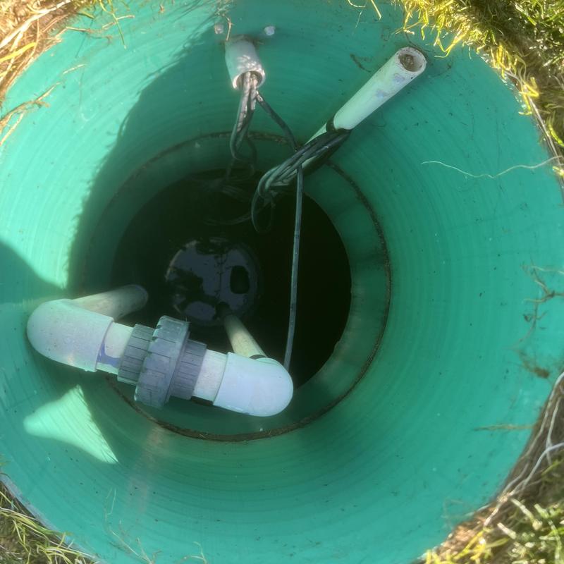 Septic tank pump chamber with pipes and wiring