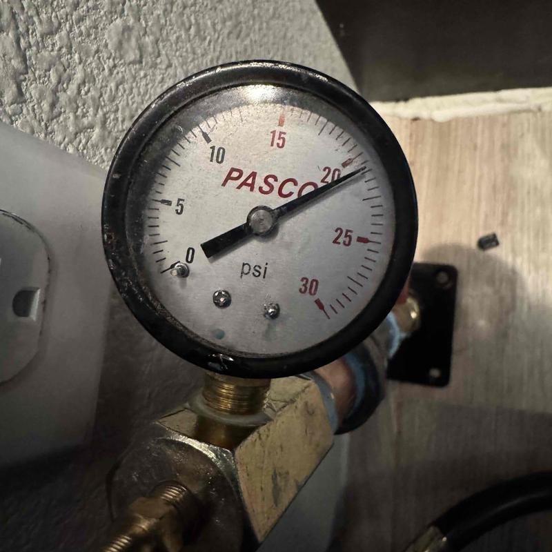 Gas line pressure gauge at water heater manifold