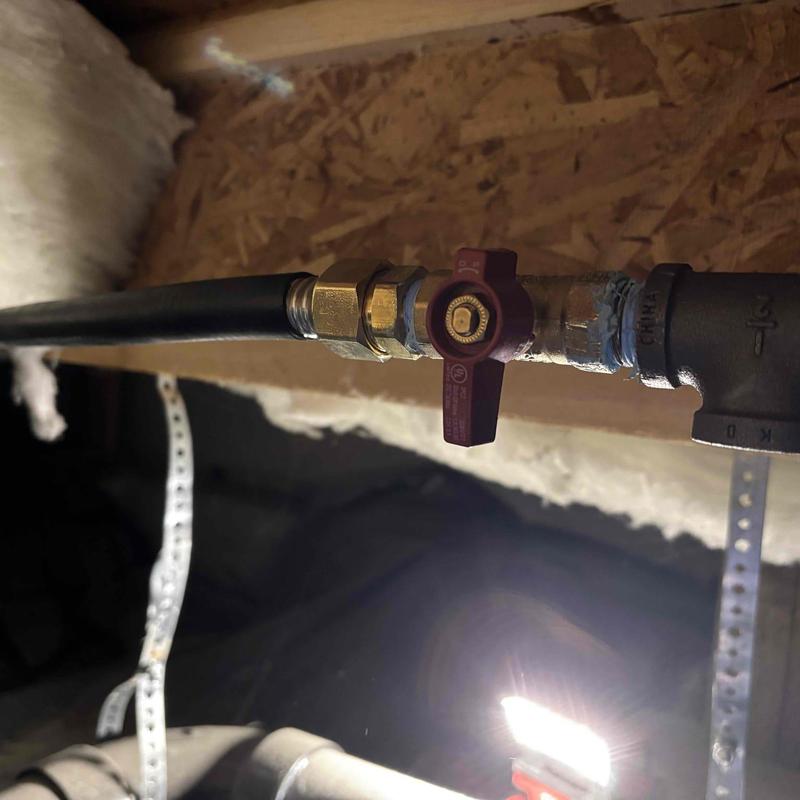 Gas test tee manifold with valve under house framing