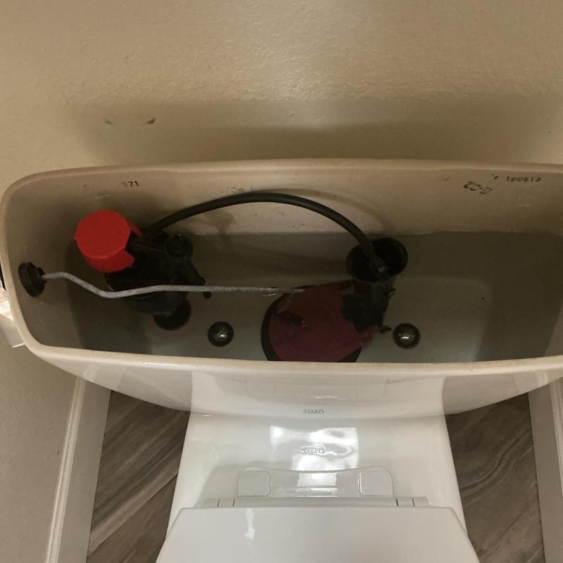 Toilet tank components with water filling and flapper valve Toilet tank components with water filling and flapper valve