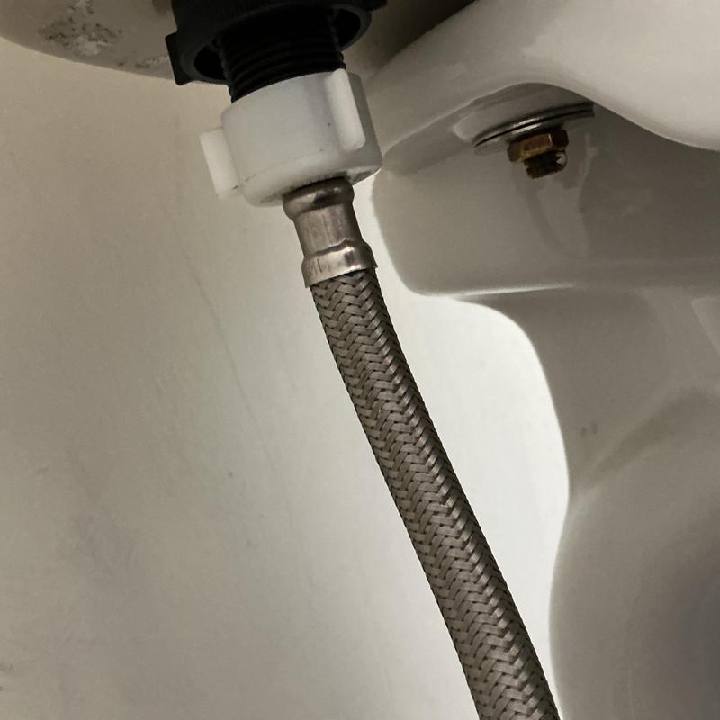 Toilet braided water supply line connection under tank Toilet braided water supply line connection under tank