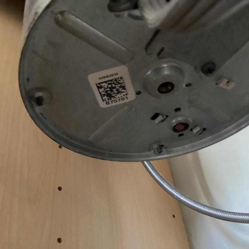 Garbage disposal underside with mounting and hose connection