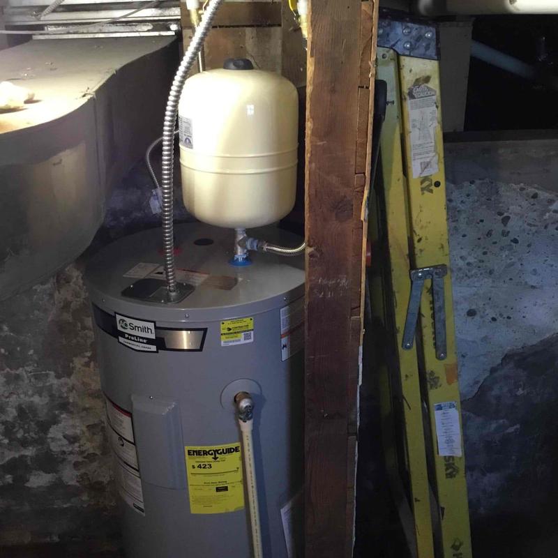 50 gallon electric water heater installed in basement