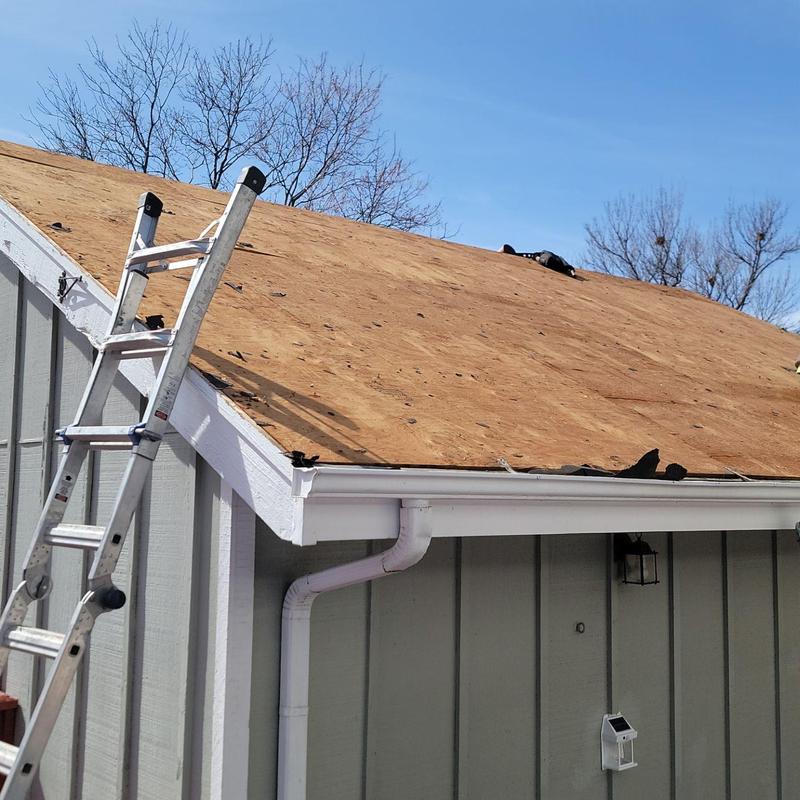 Roof decking replacement on residential house with ladder Roof decking replacement on residential house with ladder