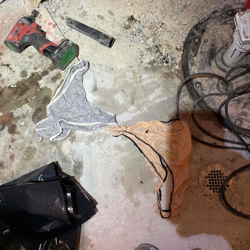 Sewage ejector pump with clogged underwear removed