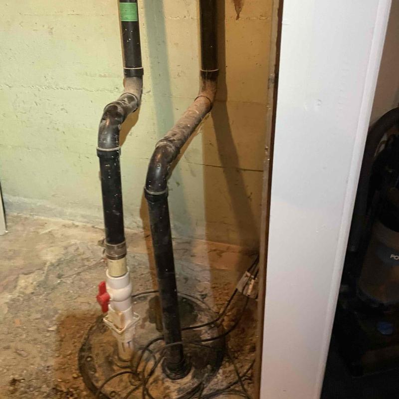 Sewage ejector pump with clogged pipes and wiring