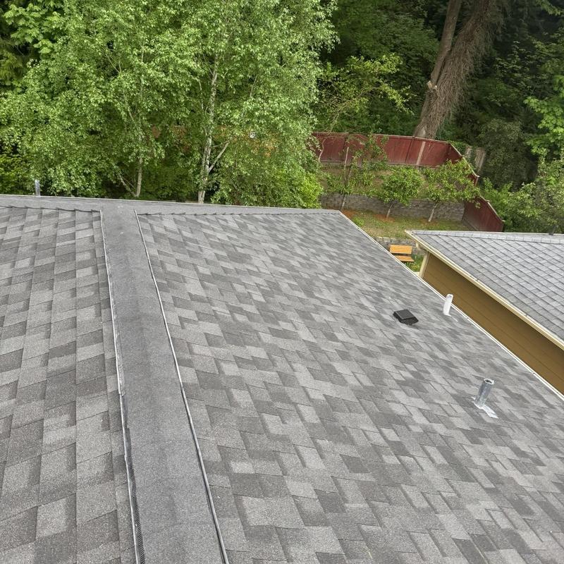 Asphalt shingle roof with clean vents and piping