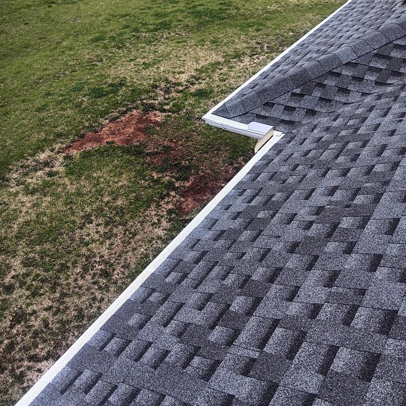 GAF HDZ shingle roof with white gutter on house corner