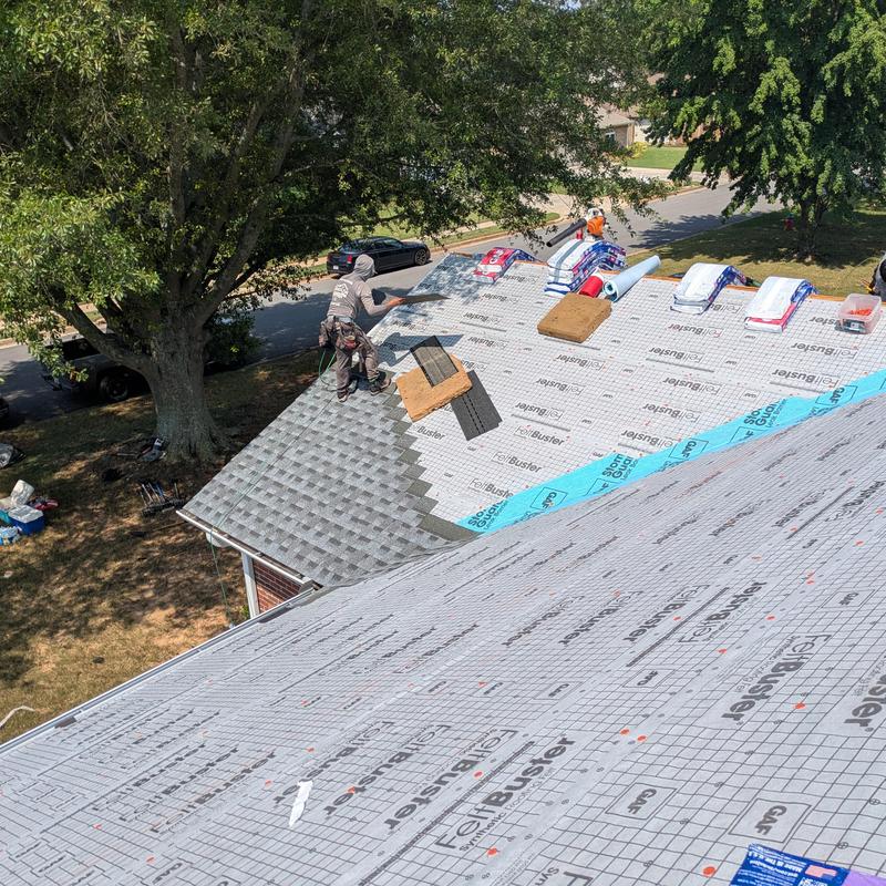 Asphalt shingle roof installation with underlayment