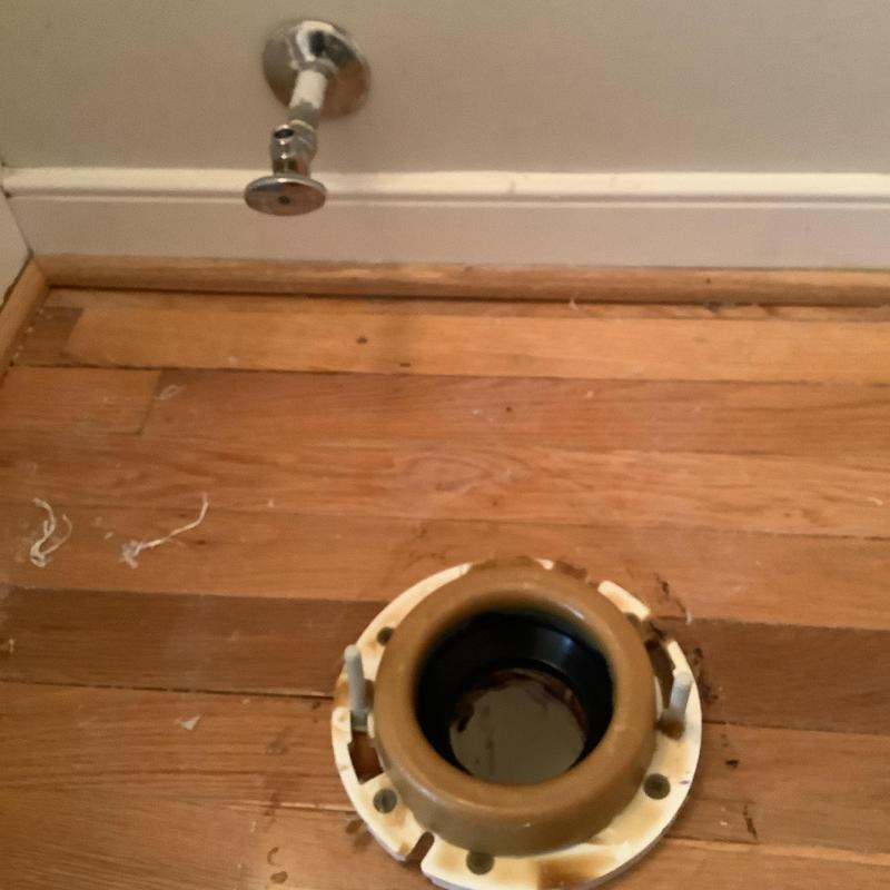 Toilet flange on hardwood floor near water supply valve Toilet flange on hardwood floor near water supply valve
