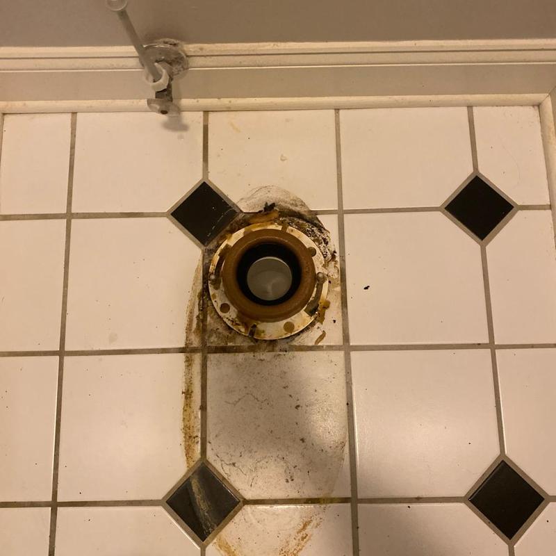 Toilet flange on tiled bathroom floor Toilet flange on tiled bathroom floor