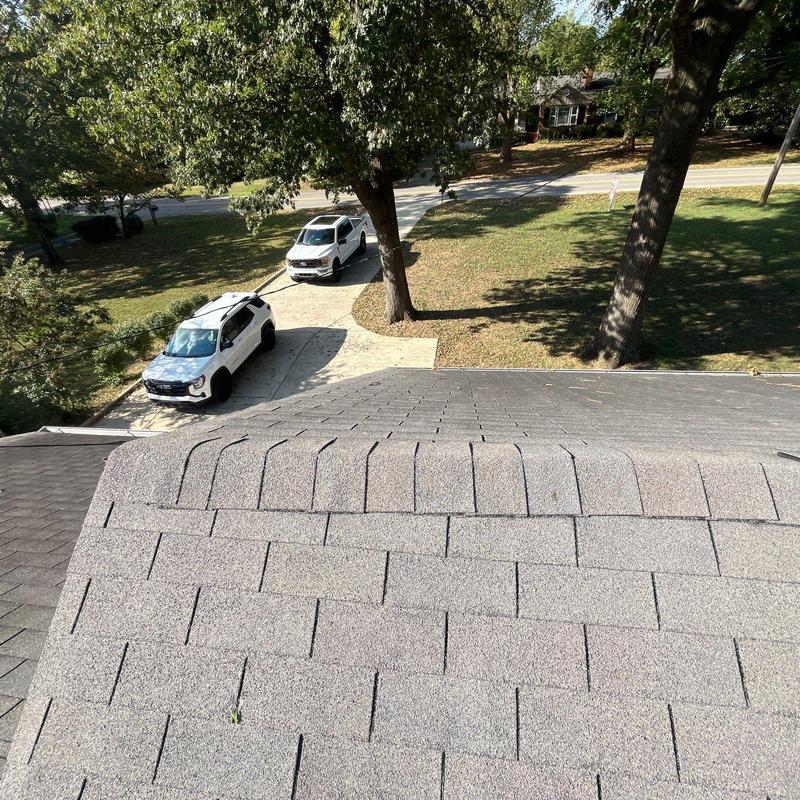 Asphalt shingles roof ridge with hail damage review