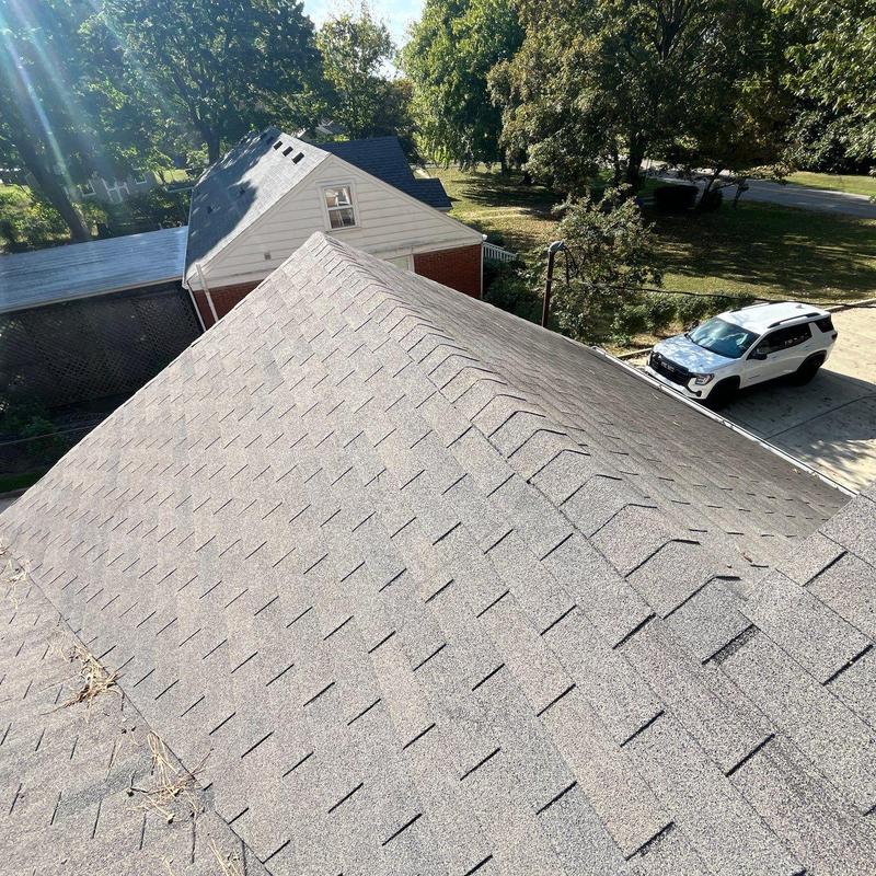 Asphalt shingle roof with hail damage inspection