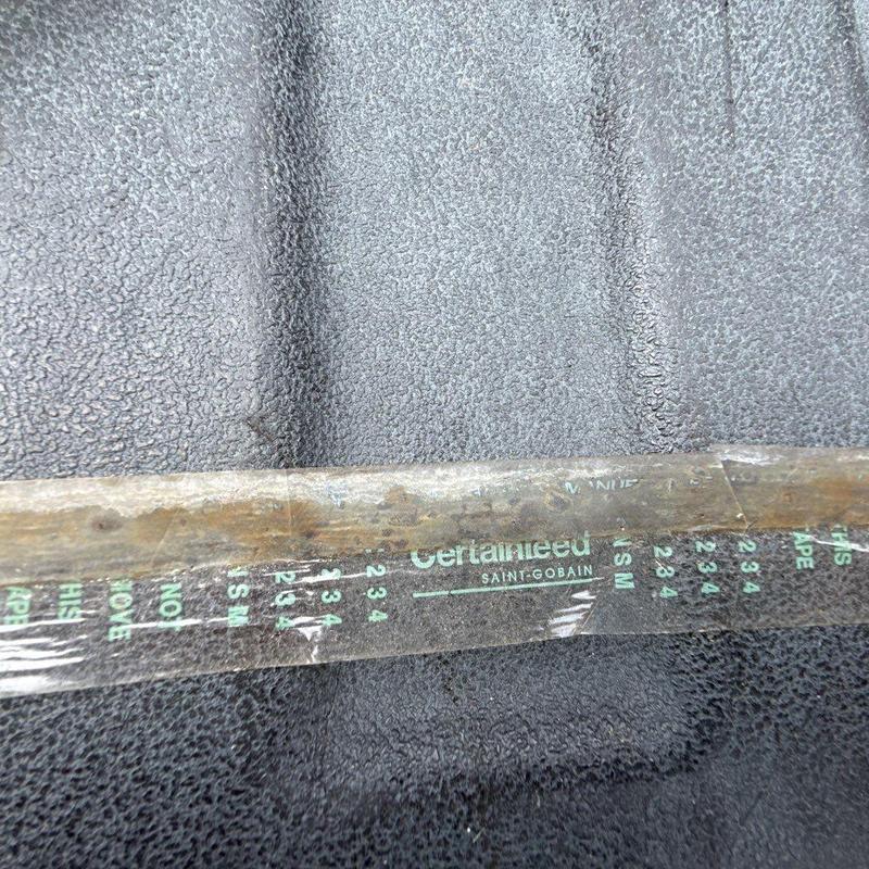 Roof underlayment layer with protective tape markings
