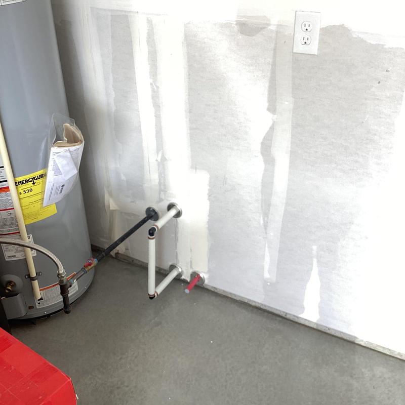 Water softener plumbing loop installation in garage wall
