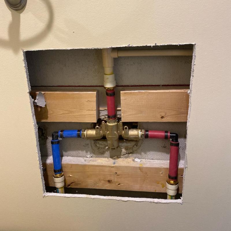 Santec shower valve with red and blue PEX piping Santec shower valve with red and blue PEX piping