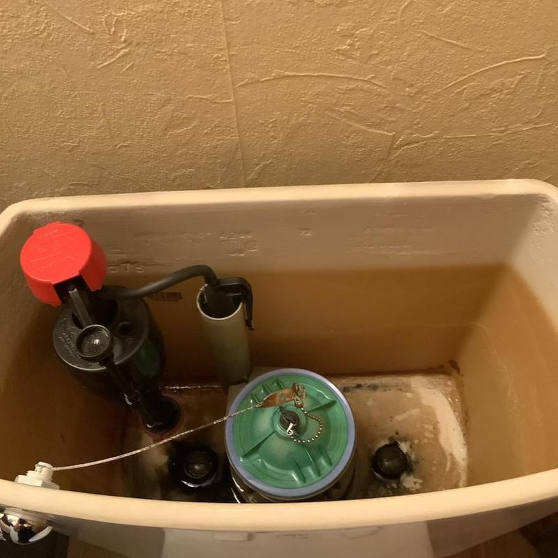 Toilet fill valve inside flush tank with new parts Toilet fill valve inside flush tank with new parts
