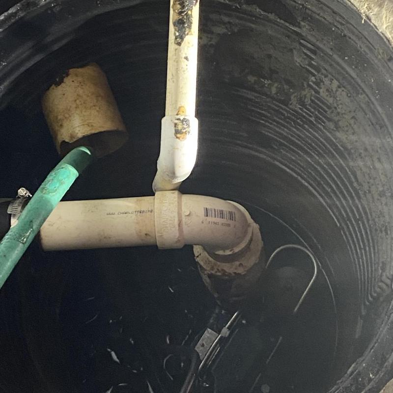 Zoeller sump pump with PVC discharge piping inside pit