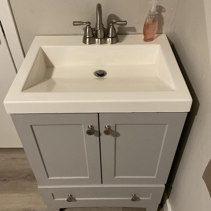 Lavatory faucet and sink installation on vanity cabinet