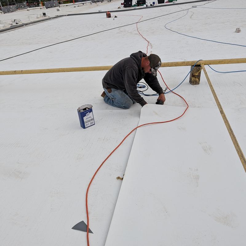 TPO single ply roofing installation on flat roof