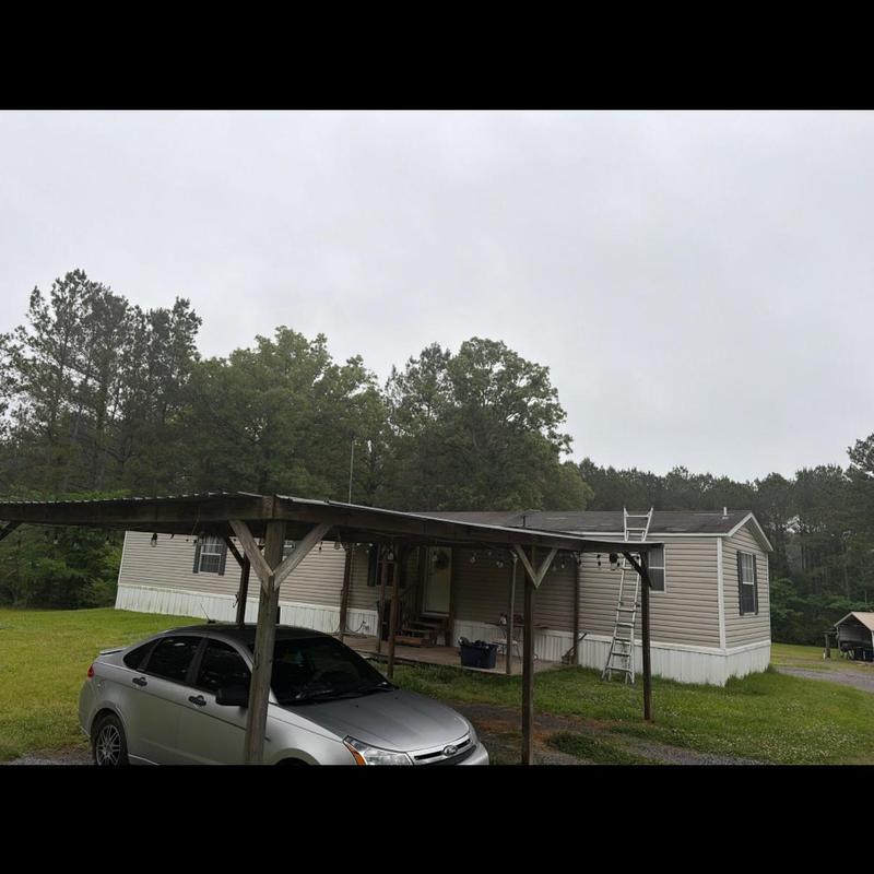 Mobile home roof with ladder for storm inspection