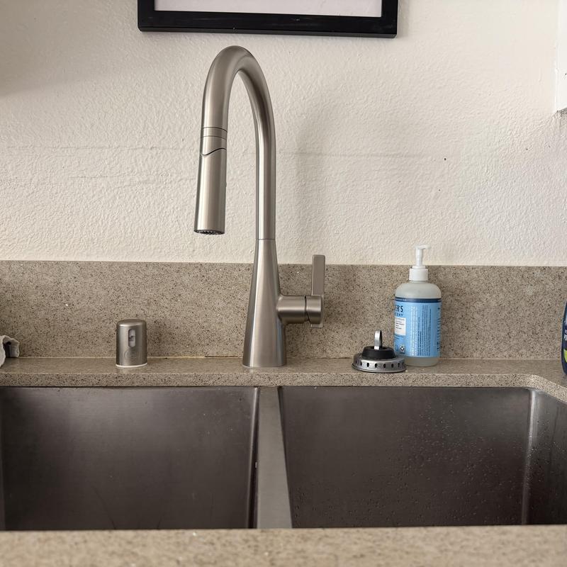 Kitchen faucet with stainless steel sink and soap dispenser