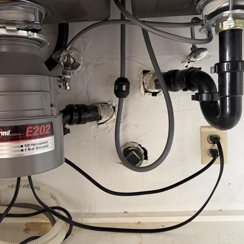 Garbage disposal and sink drain plumbing installed