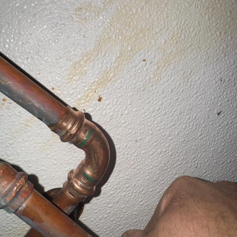 Copper waterline with elbow joint in commercial kitchen Copper waterline with elbow joint in commercial kitchen