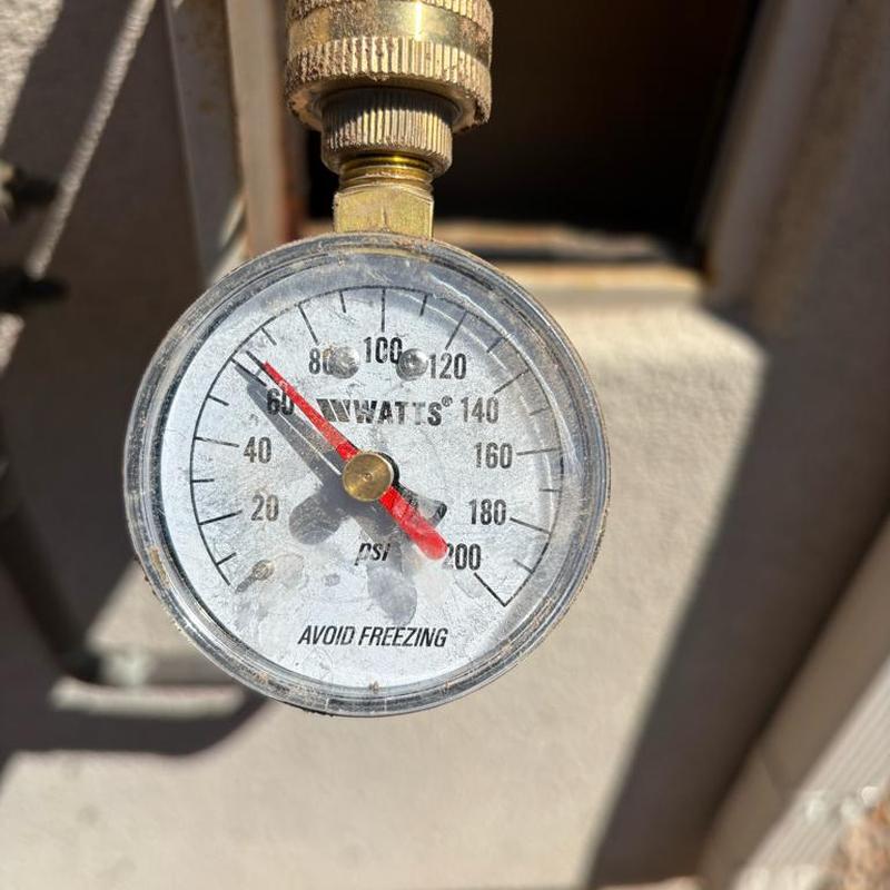 Pressure relief valve pressure gauge reading at 64 psi