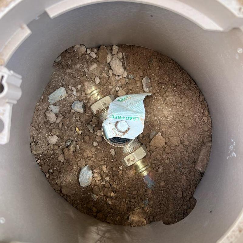 Pressure regulator valve in soil access box