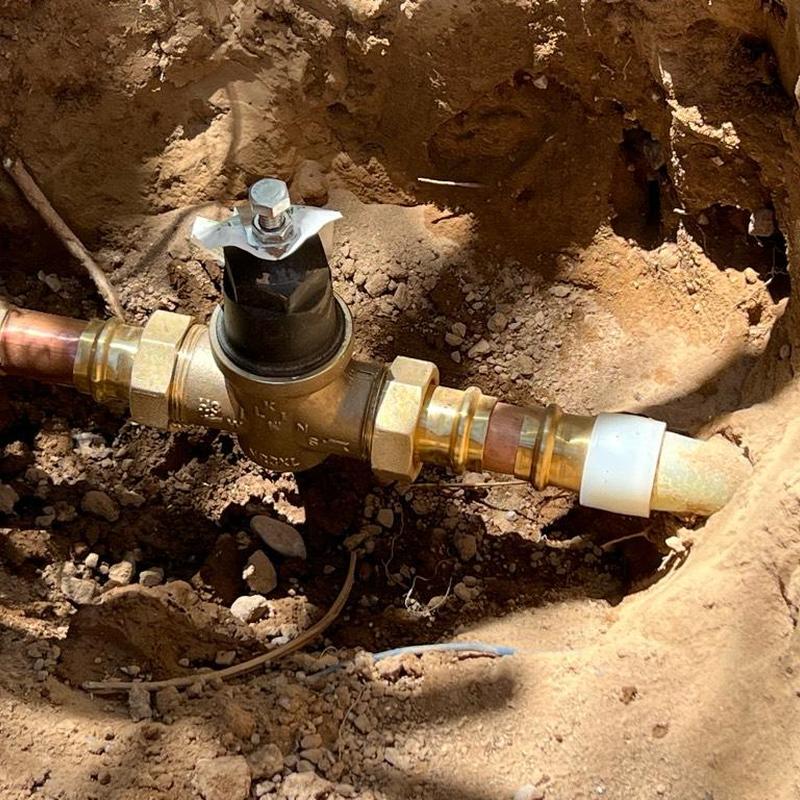 Pressure regulator valve installed on underground water line