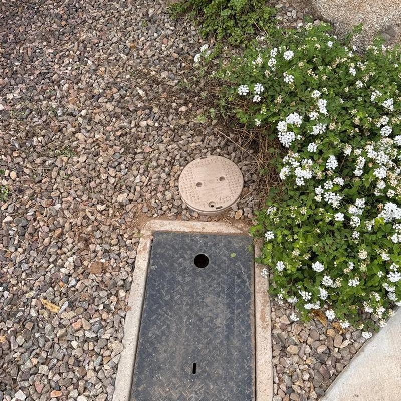 Irrigation valve box and water meter access in gravel bed