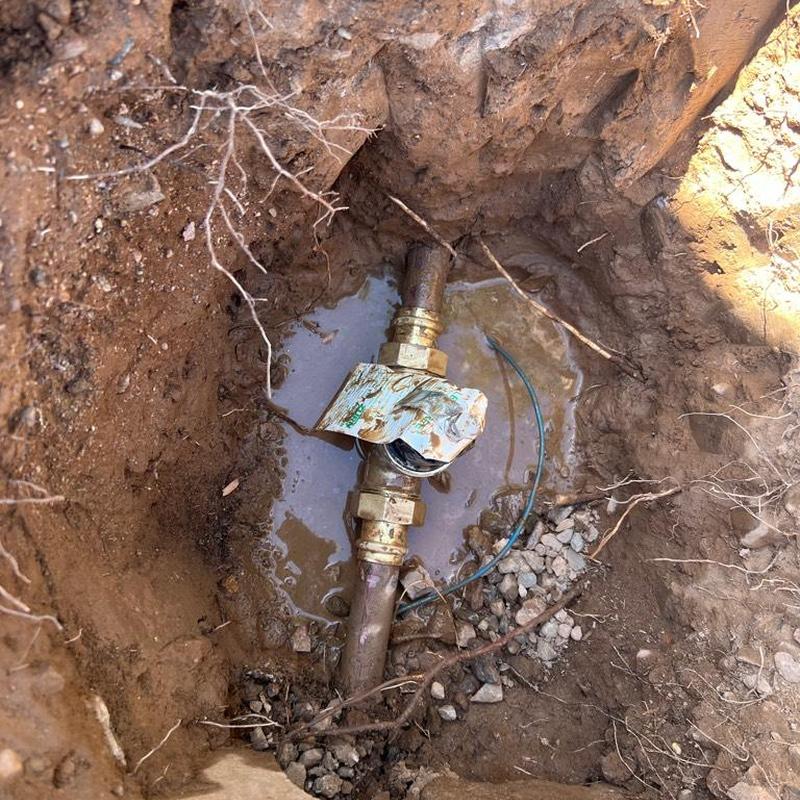 Main water line with pressure reducing valve installed in soil