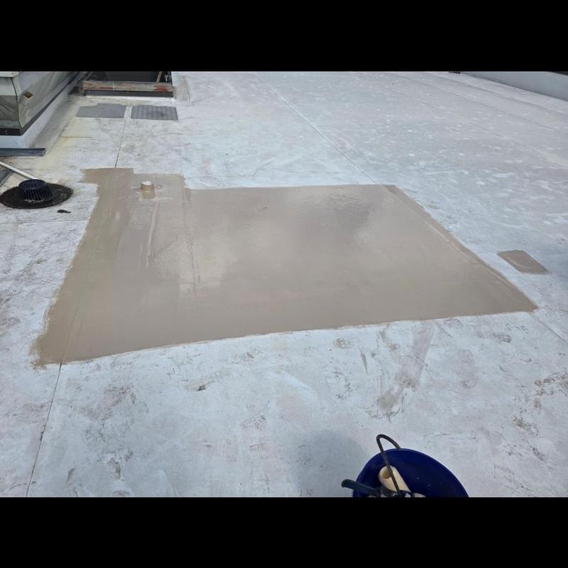 Commercial flat roof patch with sealant applied Commercial flat roof patch with sealant applied