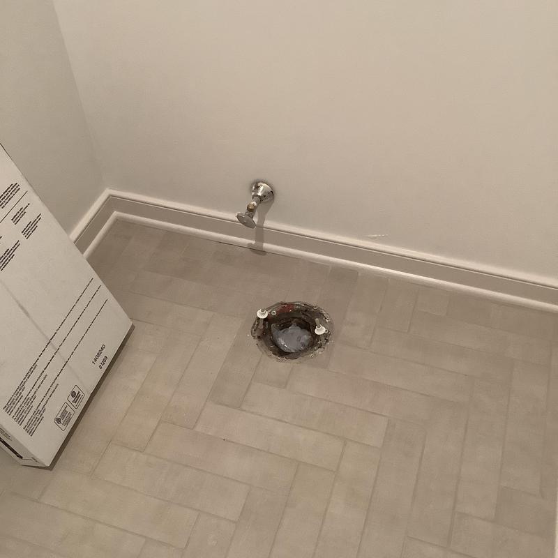 Toilet flange and water supply valve in bathroom floor Toilet flange and water supply valve in bathroom floor