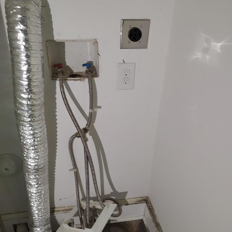 Washing machine water box with supply lines and power outlets Washing machine water box with supply lines and power outlets
