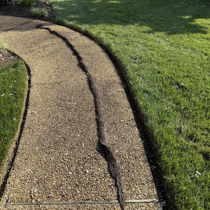 French drain trench opened along walkway edge French drain trench opened along walkway edge