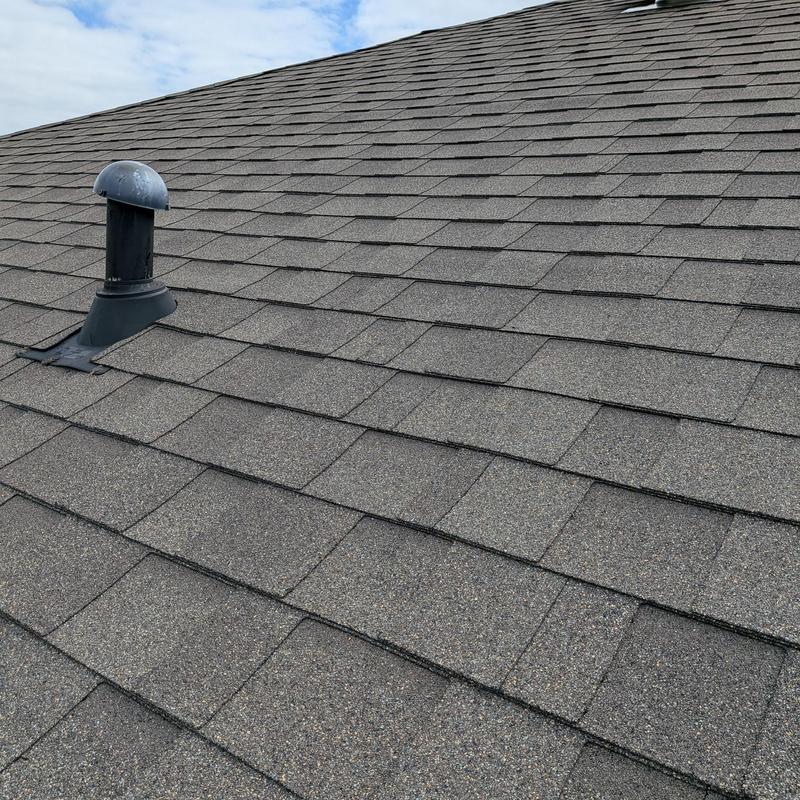 Bathroom roof vent on new home roof shingles